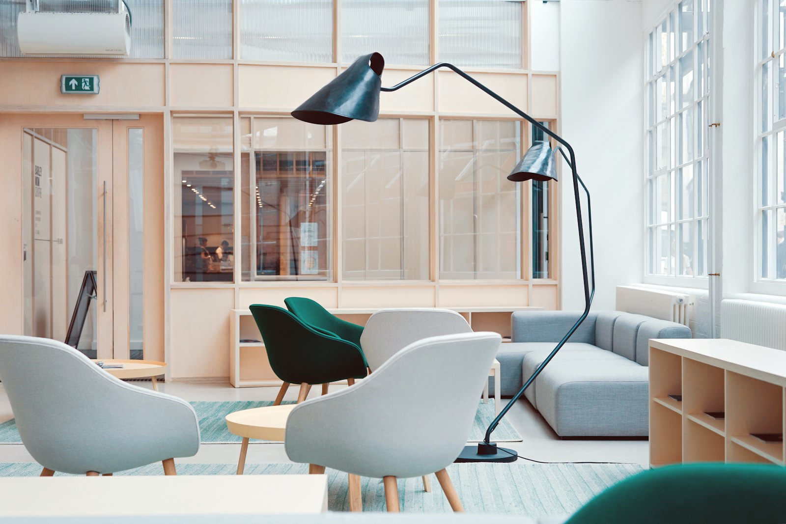 Modern design showroom at the Aram store with sculptural chairs and an arc floor lamp
